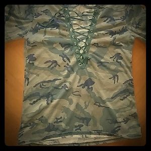 A a camouflage shirt with laces